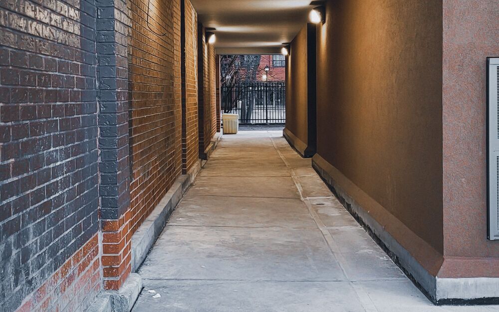 Clean, well-lit apartment breezeway